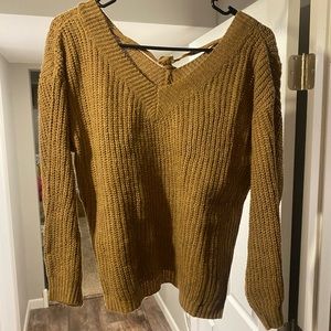 Brown sweater.